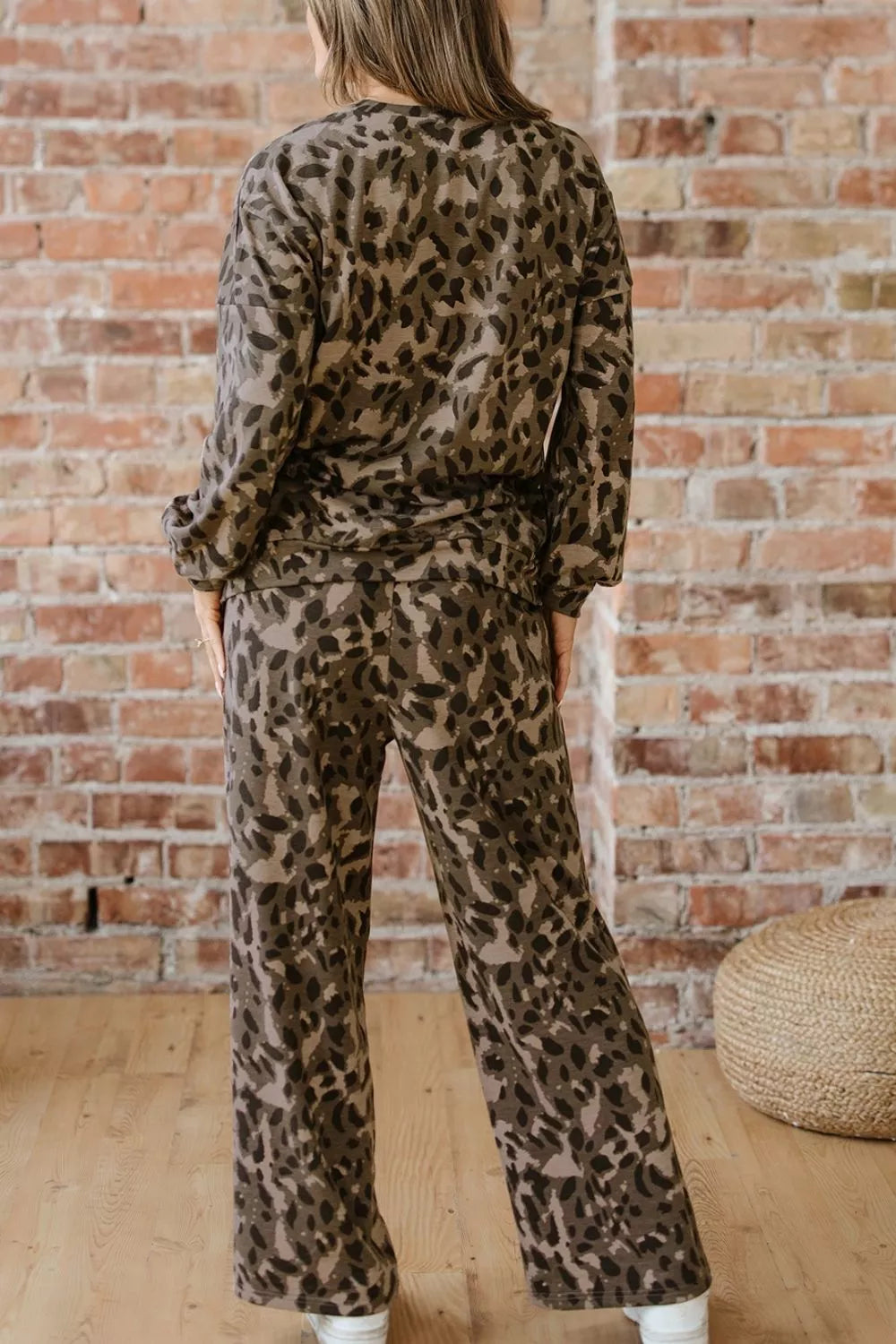 Leopard print long sleeve top and matching pants set from Trendsi, featuring a stylish animal print design.