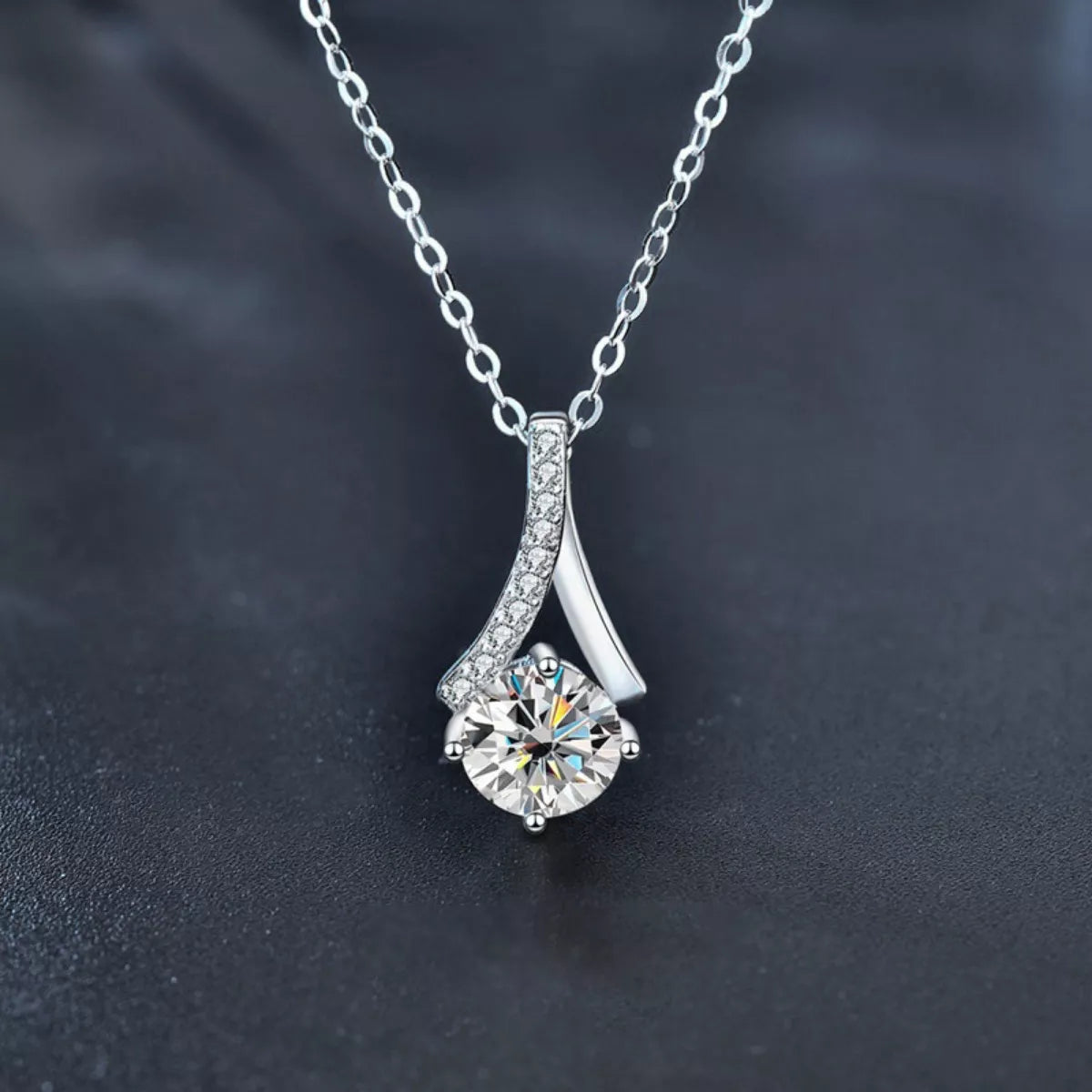 Sterling silver necklace with a 1-carat moissanite gemstone, featuring a delicate pendant design.