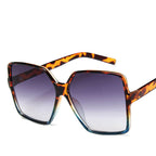 Vintage big frame sunglasses with UV400 protection, stylish fashion shades by Plush Fashion Hub, featuring dark tinted lenses