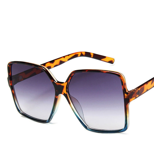 Vintage big frame sunglasses with UV400 protection, stylish fashion shades by Plush Fashion Hub, featuring dark tinted lenses
