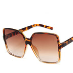 Vintage big frame sunglasses from Plush Fashion Hub with UV400 protection, stylish fashion shades for a bold look.