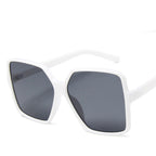 Vintage big frame sunglasses with UV400 protection, stylish fashion shades from Plush Fashion Hub, featuring dark tinted lenses and bold design.