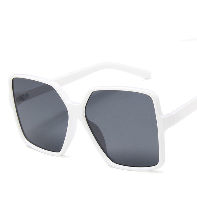 Vintage big frame sunglasses with UV400 protection, stylish fashion shades from Plush Fashion Hub, featuring dark tinted lenses and bold design.