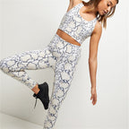 FitiqueFit snake print cropped high-waisted activewear leggings, stylish workout pants with a bold snake pattern.