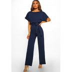 Plush Fashion Hub women's body suit with short sleeves, cut-out design, and adjustable straps, featuring a straight-leg jumpsuit style.