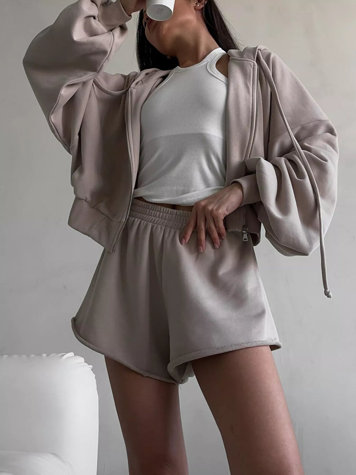 Trendsi zip-up long sleeve outerwear and matching shorts set, casual athletic style, shown on a model in a neutral setting.