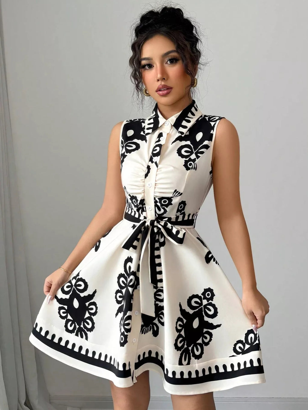 Sleeveless ruched printed tie waist dress by Shopimist featuring a fitted silhouette and vibrant floral pattern.