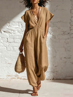 Women's deep V-neck three-quarter sleeve high waist wide-leg pants by Plush Fashion Hub, in a stylish and flowing design.
