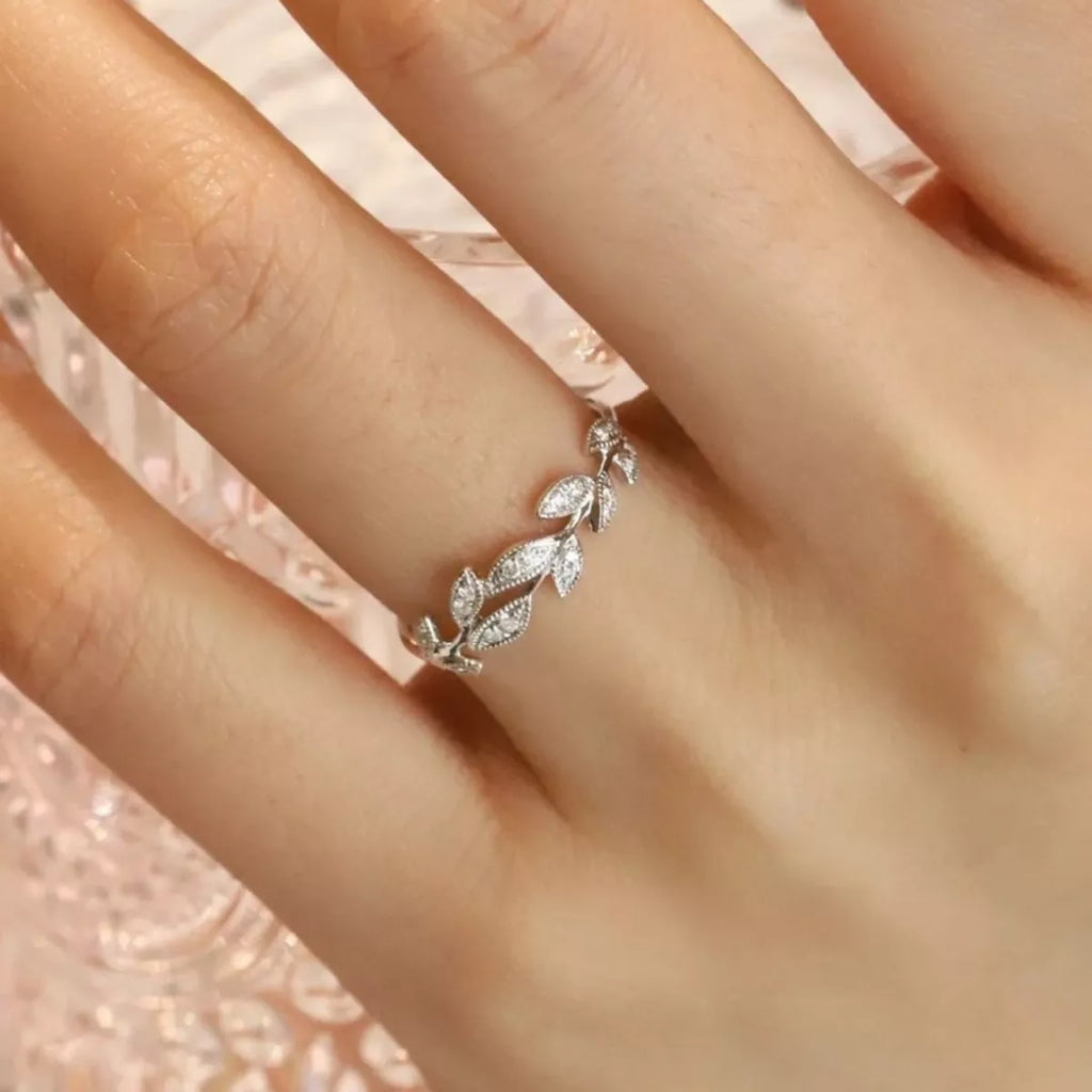 Sterling silver leaf ring with detailed leaf design, crafted by Shopimist, showcasing intricate craftsmanship on a smooth band.
