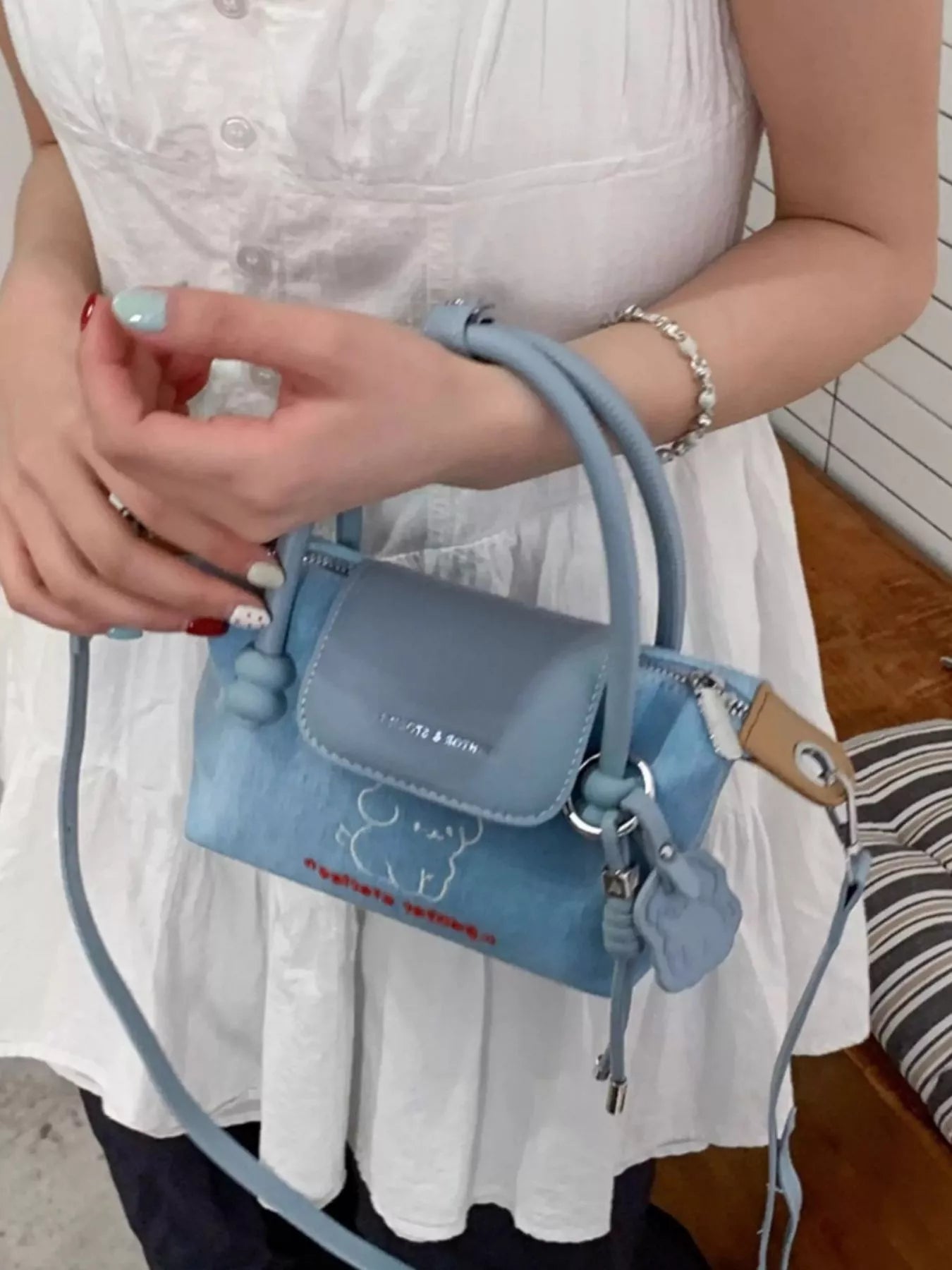Denim handbag with puppy embroidery by Shopimist featuring embroidered puppy design on blue denim tote bag.