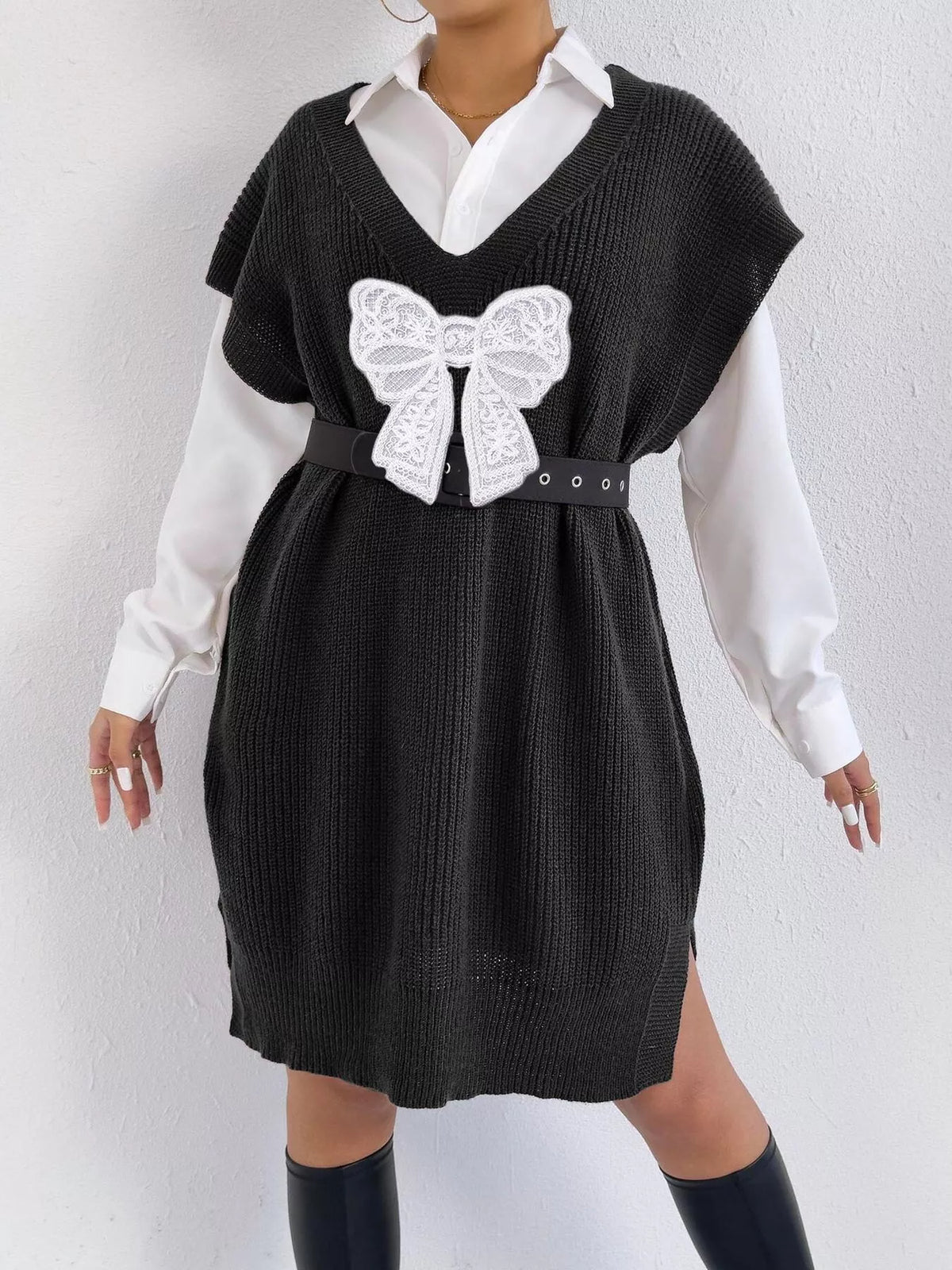 Embroidered bow V-neck sweater vest by Trendsi, featuring intricate embroidery and a classic V-neck design.