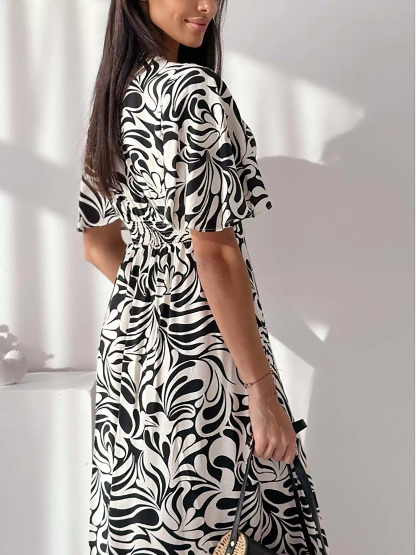 Printed flutter sleeve midi dress by Shopimist featuring a flowing silhouette and vibrant floral pattern.