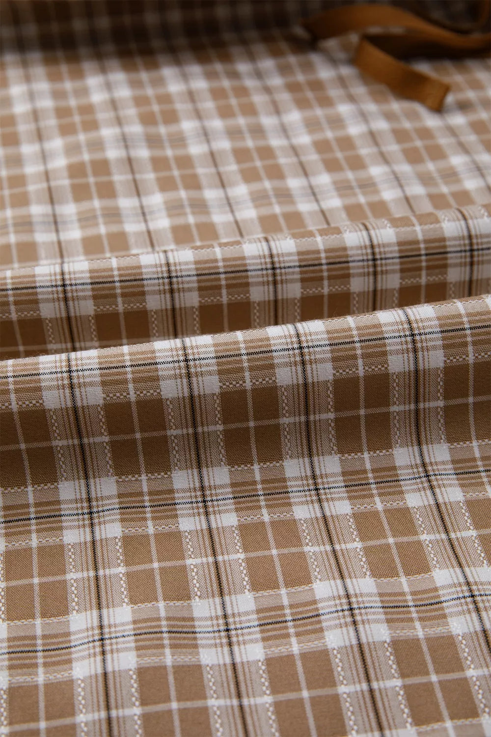 Casual plaid print pants with tie detail from Plush Fashion Hub, featuring a relaxed fit and stylish design.