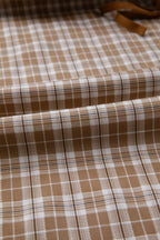 Casual plaid print pants with tie detail from Plush Fashion Hub, featuring a relaxed fit and stylish design.