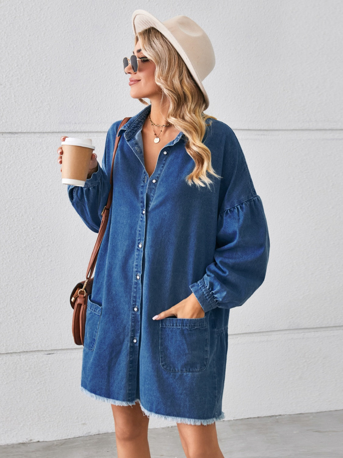 VYSN button-up denim dress with chest pockets and raw hem, stylish casual clothing for women, shown on a model.