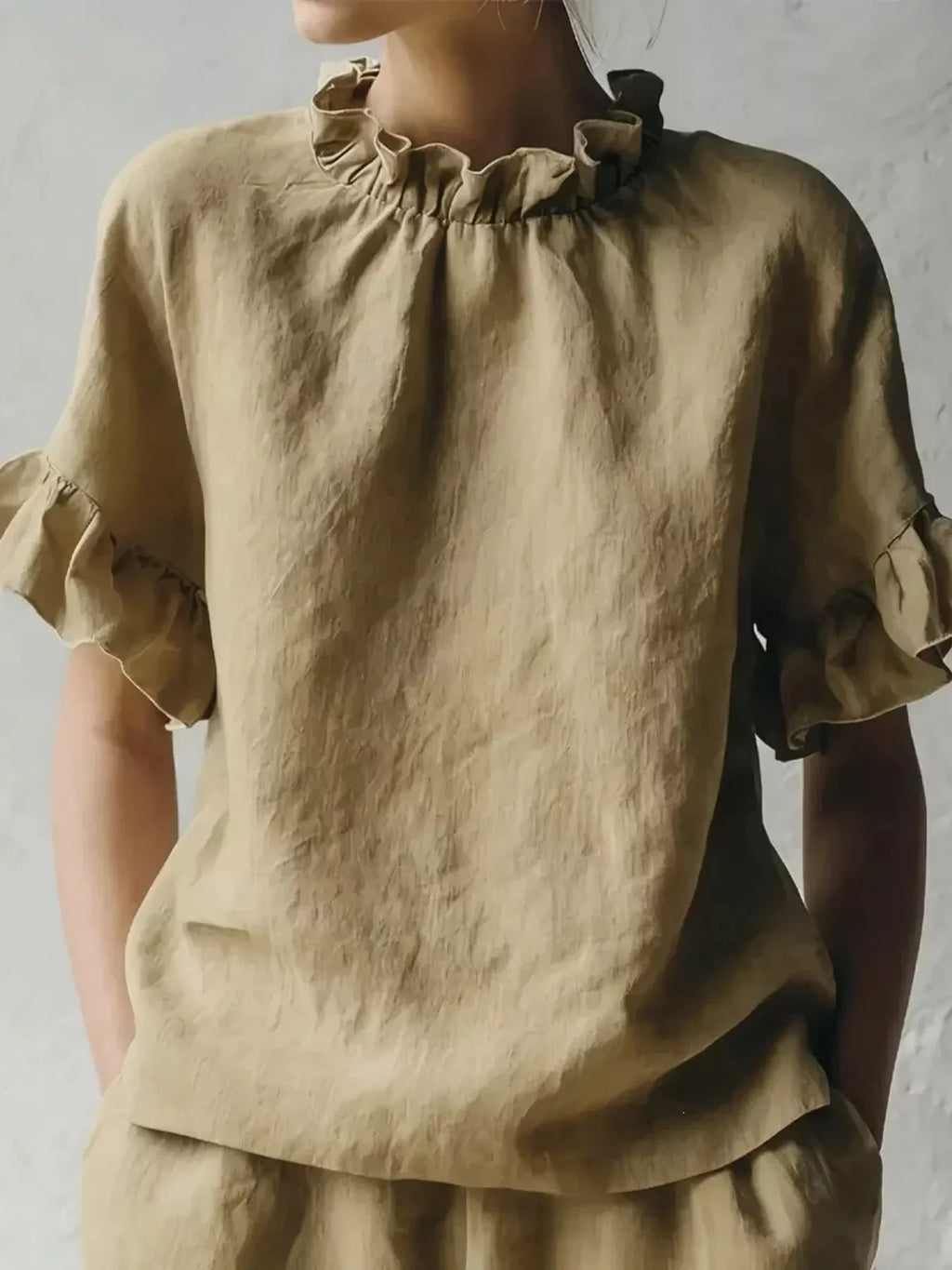 Plus size Shopimist blouse with ruffled neck and half sleeves, stylish and comfortable for everyday wear.