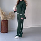 Women’s solid color casual two-piece set by FitiqueFit featuring a loose top and bootcut pants for comfortable everyday wear.