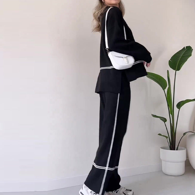 Women’s solid color casual two-piece set by FitiqueFit with loose top and bootcut pants, perfect for relaxed everyday wear.