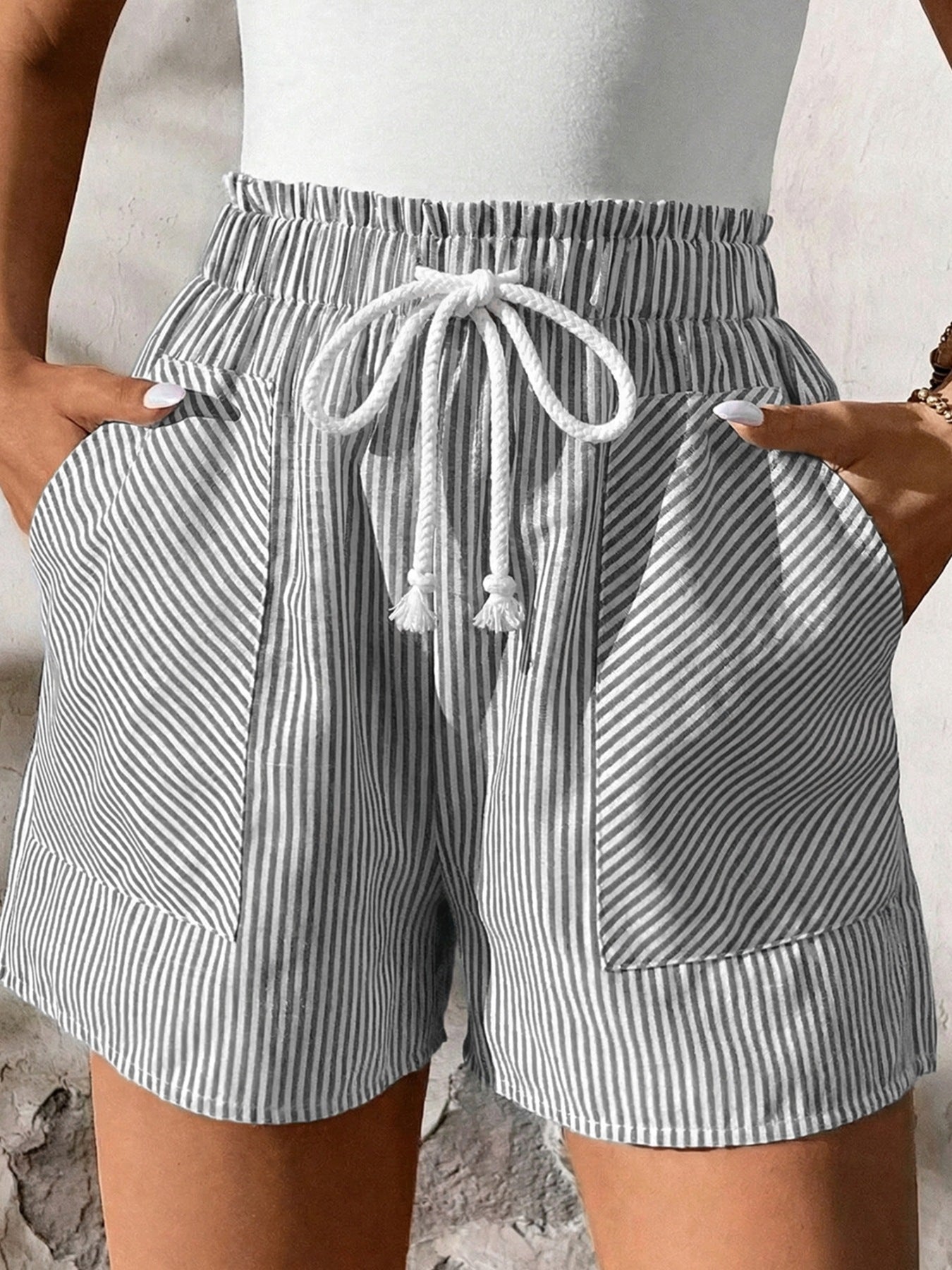 Women's striped elastic waist drawstring shorts from Plush Fashion Hub, casual summer beachwear bottoms with a relaxed fit.