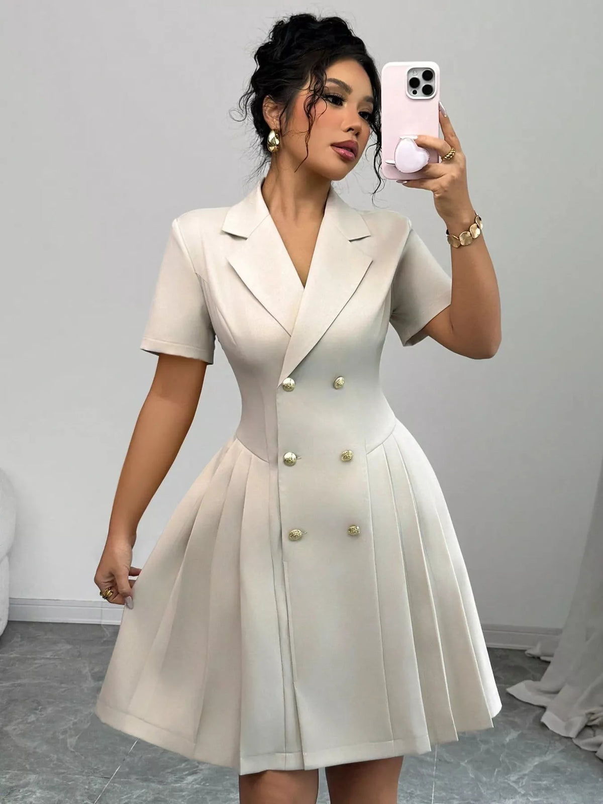 Plush Fashion Hub double-breasted pleated blazer dress featuring structured lapels and tailored fit, shown on a neutral background.
