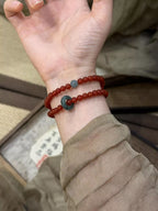 Double layered agate beaded bracelet featuring smooth, polished stones in natural tones, stylish accessory for casual or elegant wear.