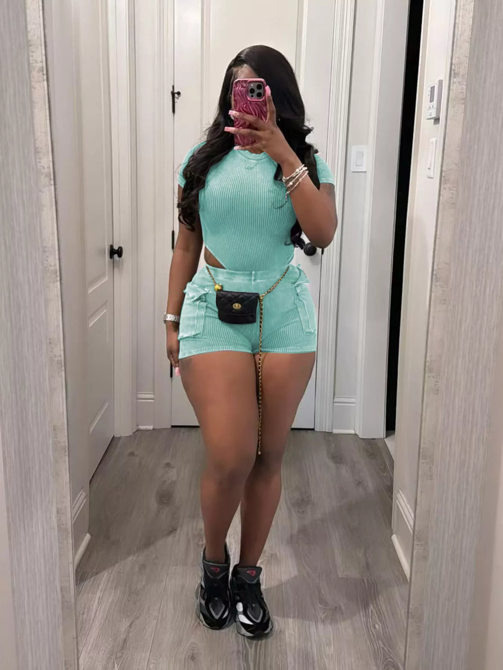 Ribbed knit bodysuit and shorts set by Shopimist, featuring a fitted design in soft, stretchy fabric, displayed on a neutral background.