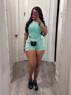 Ribbed knit bodysuit and shorts set by Shopimist, featuring a fitted design in soft, stretchy fabric, displayed on a neutral background.