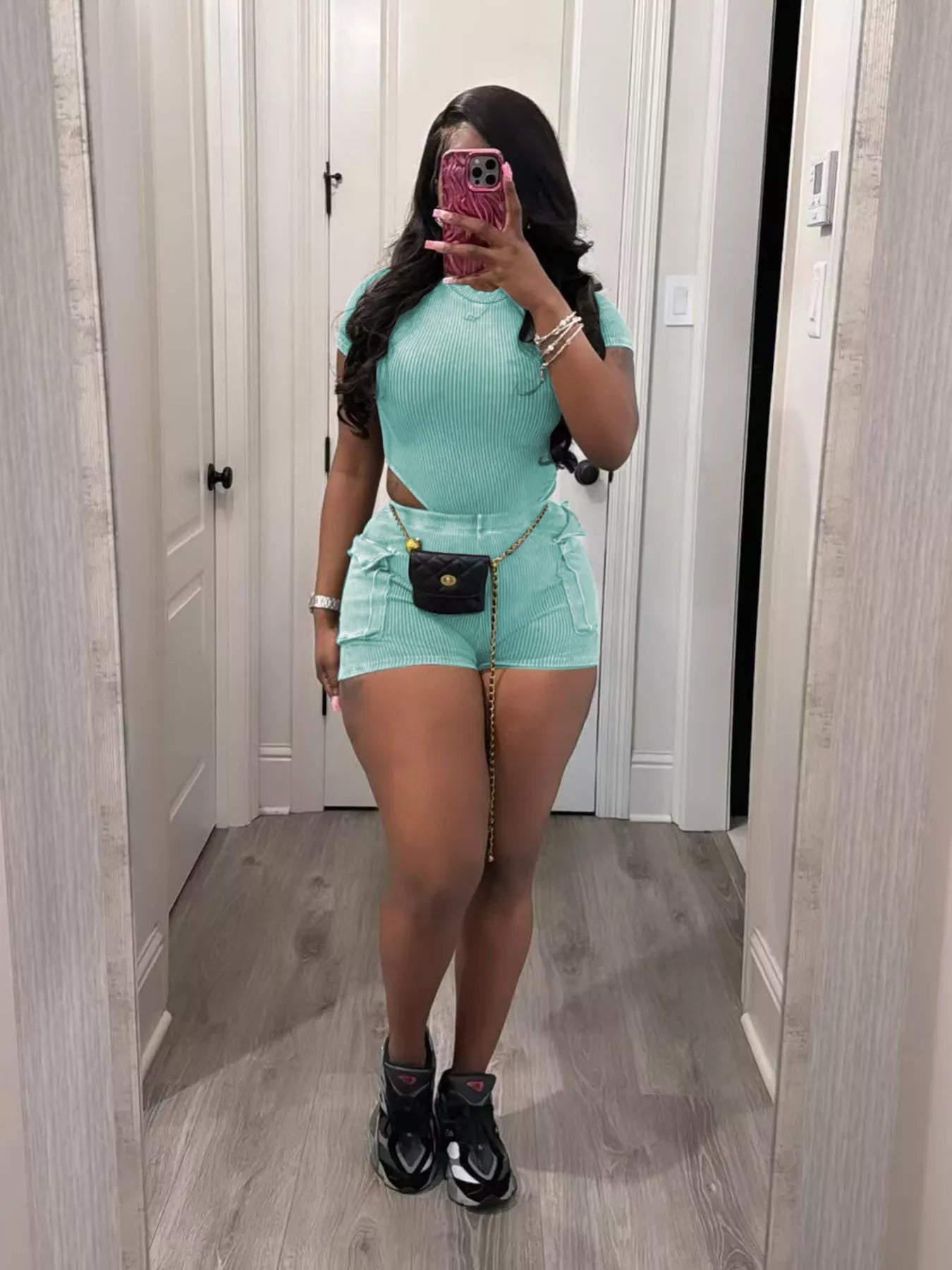Ribbed knit bodysuit and shorts set by Shopimist, featuring a fitted design in soft, stretchy fabric, displayed on a neutral background.