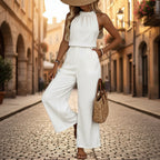 Women's draped neck sleeveless vest and casual pants two-piece set from Plush Fashion Hub, styled for a relaxed look.