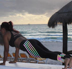 Women’s printed activewear workout leggings by FitiqueFit, slim fit pencil pants with colorful geometric patterns.
