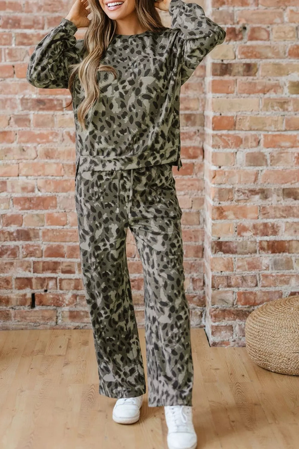Leopard print long sleeve top and matching pants set by Trendsi, featuring a stylish animal print design and comfortable fit.
