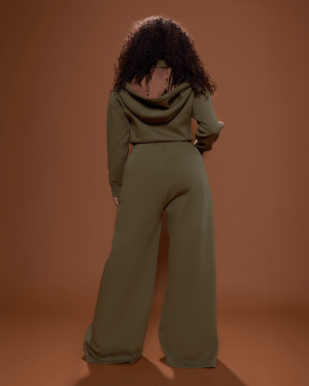 Green satin-lined jumpsuit by Plush Fashion Hub, featuring a stylish fit and smooth satin interior, perfect for elegant casual wear.