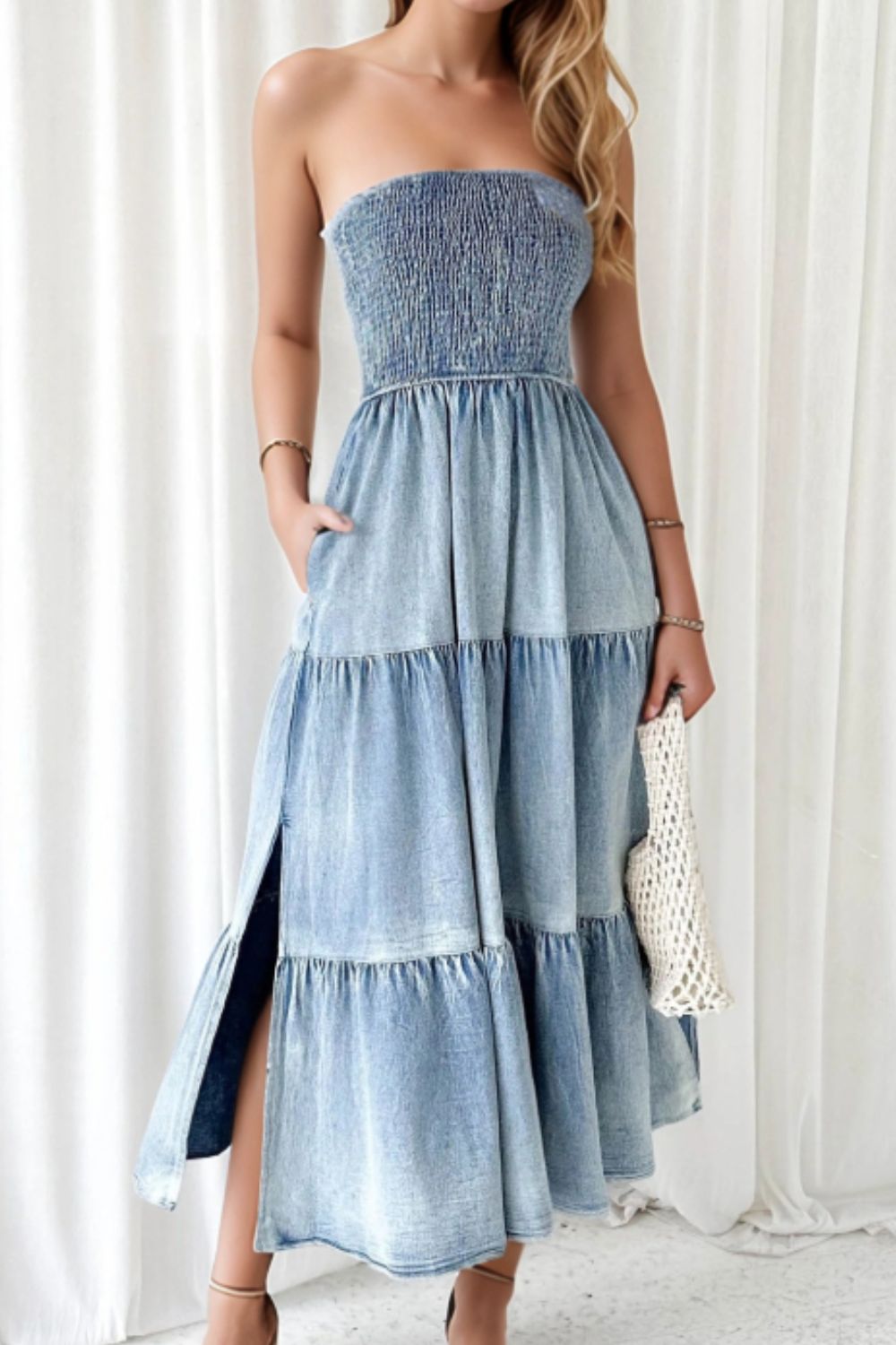 Smocked tube slit tiered denim dress by Plush Fashion Hub, showing a stylish sleeveless dress with a fitted bodice and flowing skirt.