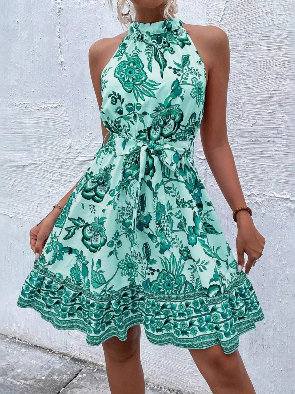 Printed sleeveless tie waist dress from Shopimist featuring a stylish pattern and a flattering waist tie.