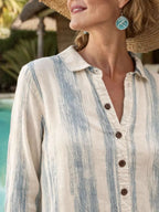 Classic striped button-down midi dress with pockets from Trendsi, featuring a relaxed fit and stylish design.