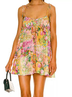Floral print tie-shoulder mini dress by Trendsi featuring a colorful, feminine design and lightweight fabric.