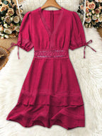 Lace detail V-neck mini dress by Shopimist featuring delicate lace accents and a fitted silhouette on a model.