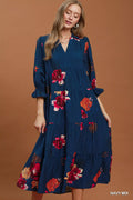 Umgee floral print tiered midi dress with puff sleeves, featuring a feminine design and lightweight fabric, styled for casual wear.