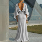 Silver women's backless pleated batwing sleeve maxi dress by FitiqueFit, featuring a mermaid gown silhouette with elegant design.