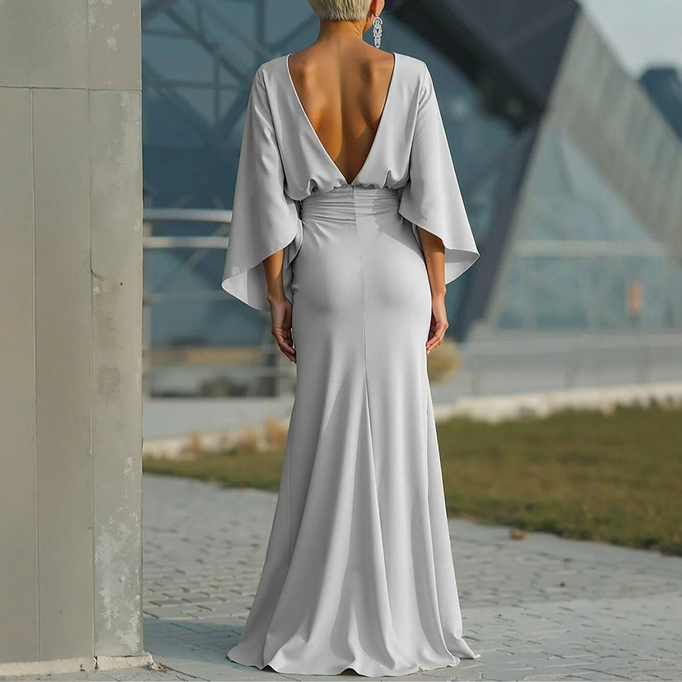 Silver women's backless pleated batwing sleeve maxi dress by FitiqueFit, featuring a mermaid gown silhouette with elegant design.
