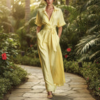 Women's solid color waist-slimming maxi dress with flip collar by Plush Fashion Hub, featuring a stylish and fitted silhouette.