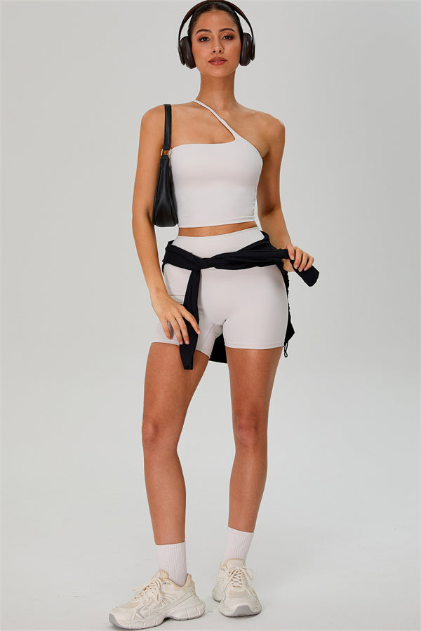 Fitglutes activewear one-shoulder crop top and shorts 2-piece set, stylish gymwear and sportswear for workout and fitness.