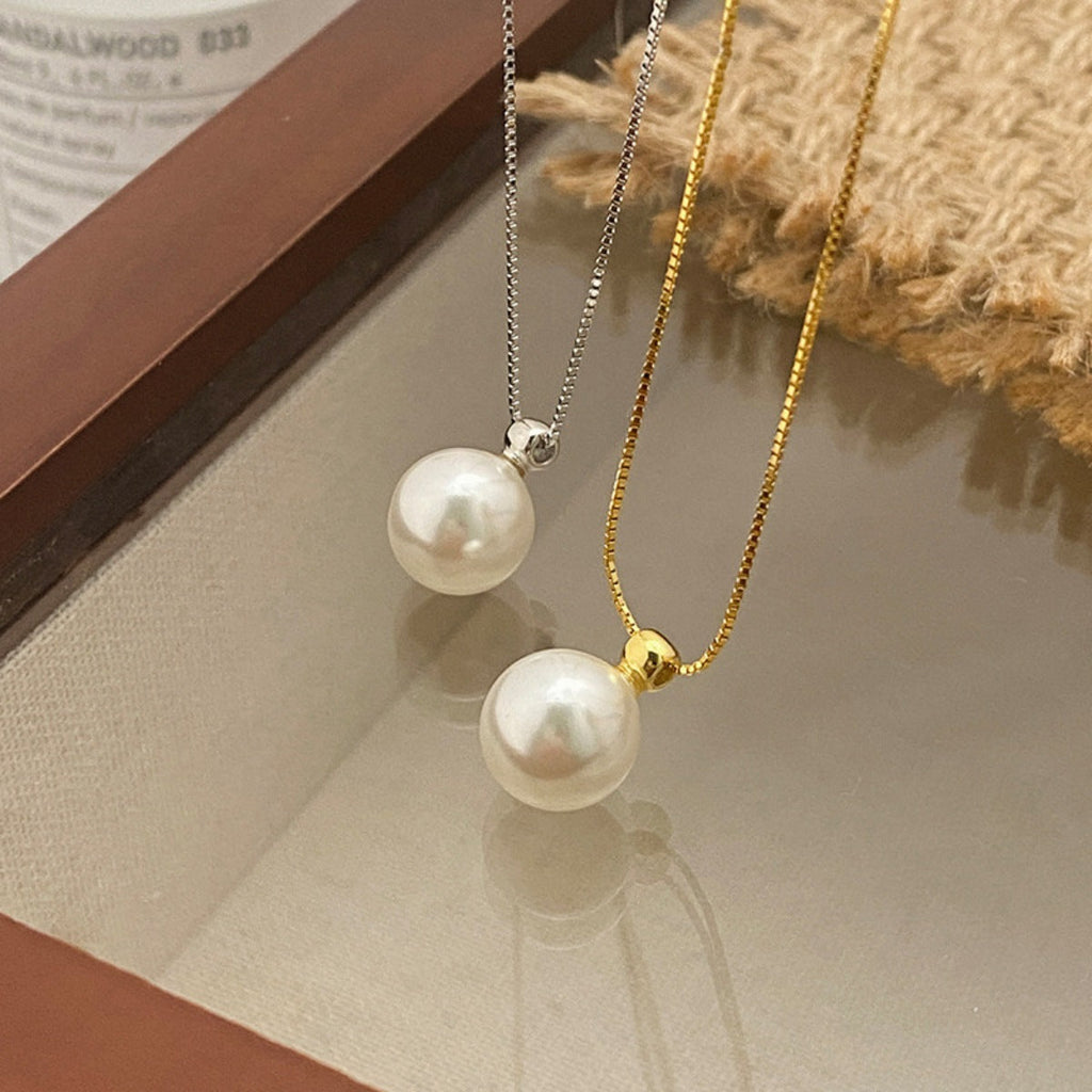 Sterling silver pearl pendant necklace with a round white pearl on a delicate chain, stylish jewelry by Shopimist.