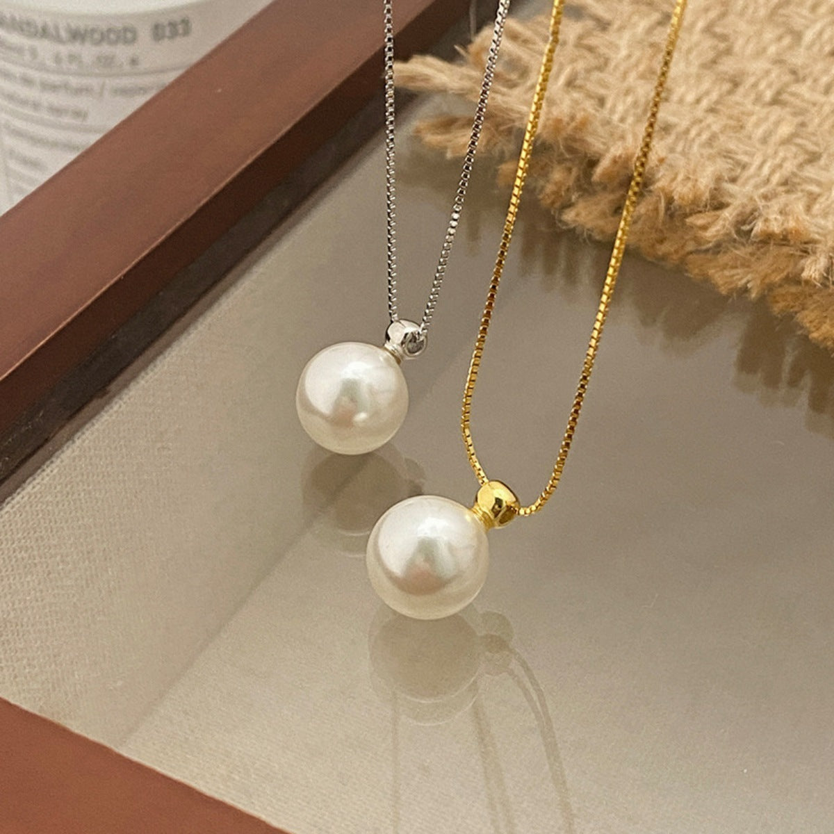 Sterling silver pearl pendant necklace with a round pearl on a delicate chain, stylish jewelry from Plush Fashion Hub