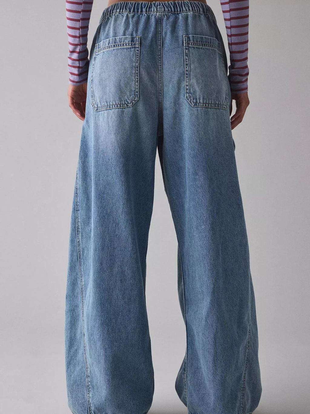 Women's relaxed fit cargo denim jeans with drawstring waist and utility pockets by Trendsi, shown from the front.