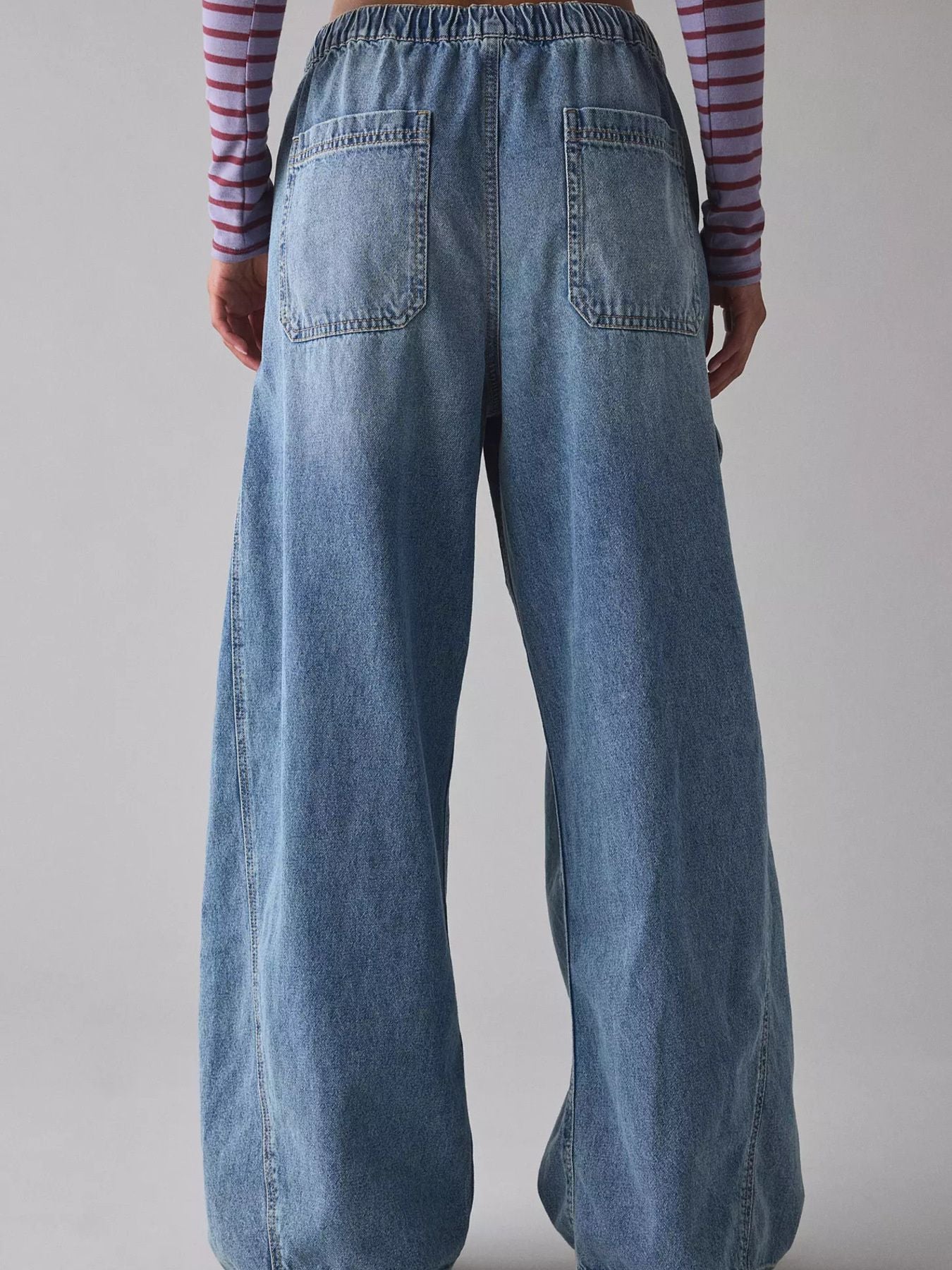 Women's relaxed fit cargo denim jeans with drawstring waist and utility pockets by Trendsi, shown from the front.