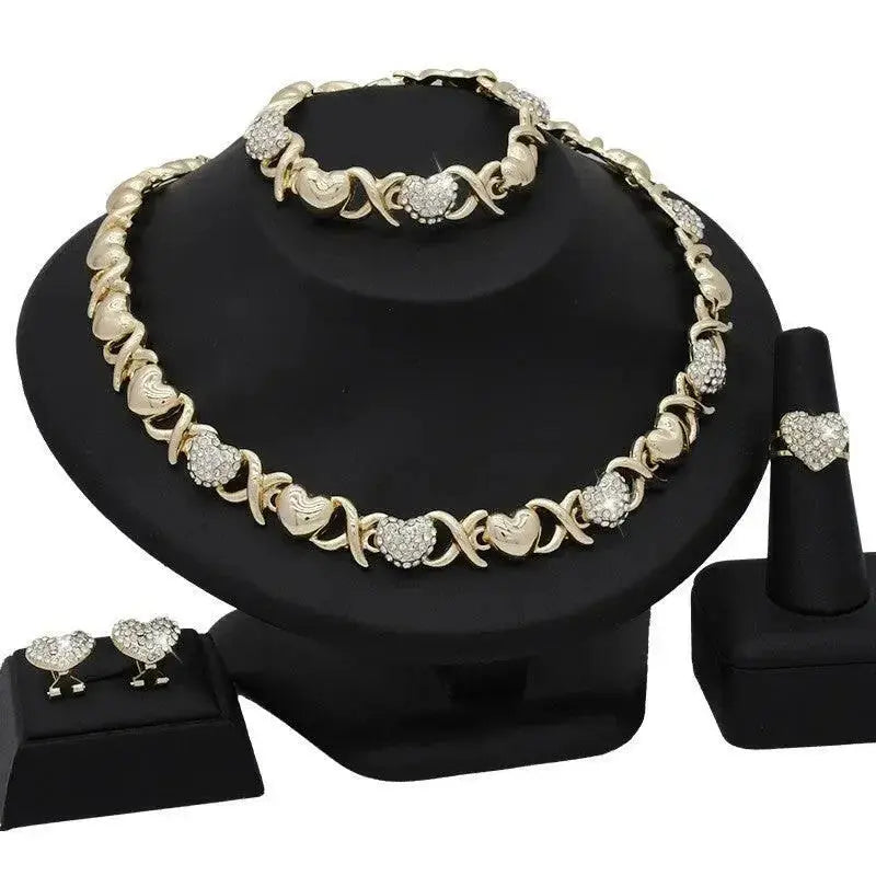 18K gold heart-shaped pendant necklace and matching earrings jewelry set for women, designed by Plush Fashion Hub.