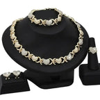 18K gold heart-shaped pendant necklace and matching earrings jewelry set for women, designed by Plush Fashion Hub.