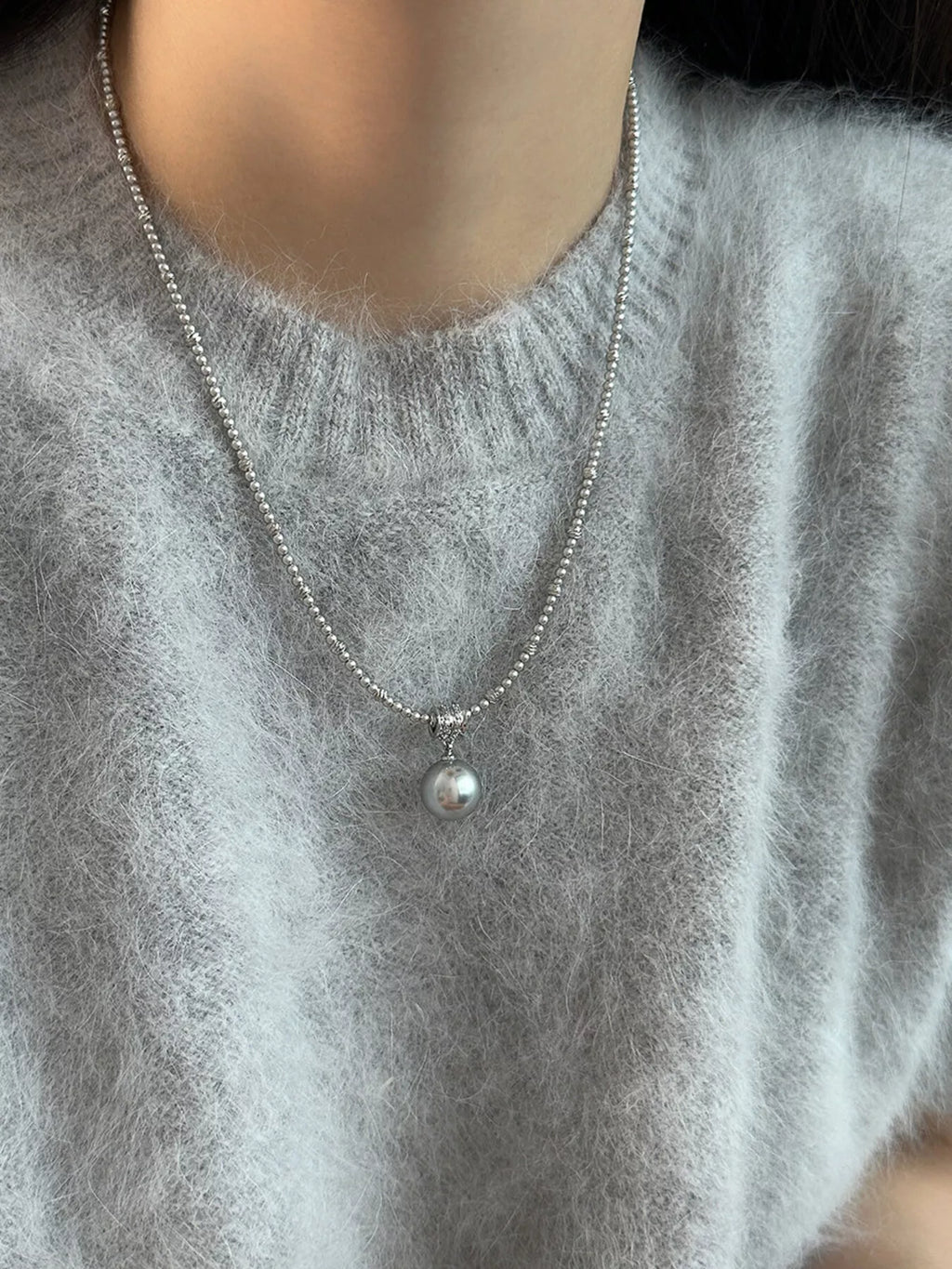 Pearl pendant necklace featuring a single white pearl on a delicate silver chain, elegant jewelry accessory from Shopimist.