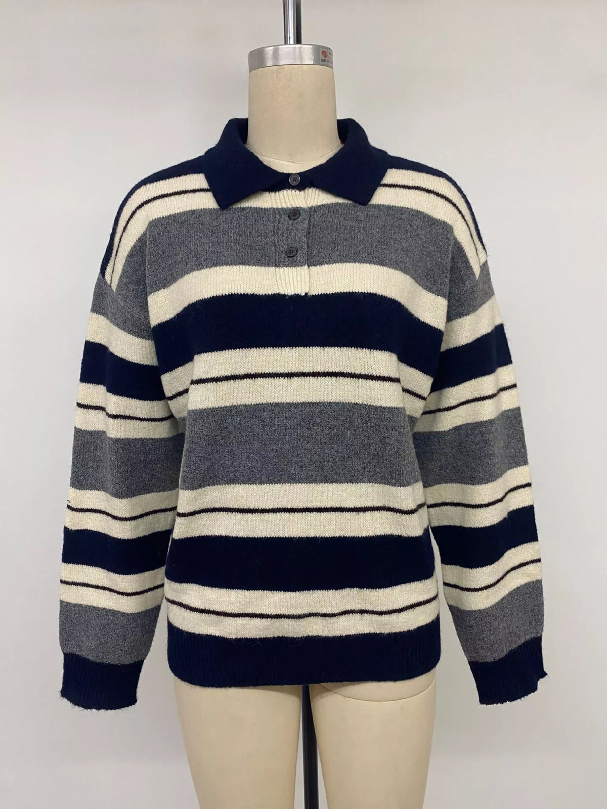 Striped long sleeve sweater with button details by Plush Fashion Hub, featuring a cozy knit fabric and a classic design.